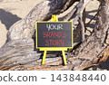 Branding and your brands story symbol. Concept words Your brands story on beautiful blackboard. Beautiful old tree background. Business branding your brands story concept. Copy space. 143848440