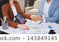 Business professional analyzing financial data on digital tablet dashboard with calculator and laptop, representing accounting software, ERP system integration, performance monitoring. 143849145