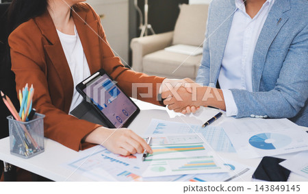 Business professional analyzing financial data on digital tablet dashboard with calculator and laptop, representing accounting software, ERP system integration, performance monitoring. Business professional analyzing financial data on digital tablet dashboard with calculator and laptop, representing accounting software, ERP system integration, performance monitoring. 143849145