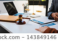 Businessmen or lawyers working together at a meeting, teamwork and partnership. Signing documents, contracts, checking details business agreement 143849146