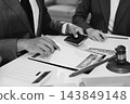 Businessmen or lawyers working together at a meeting, teamwork and partnership. Signing documents, contracts, checking details business agreement 143849148