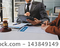 Businessmen or lawyers working together at a meeting, teamwork and partnership. Signing documents, contracts, checking details business agreement 143849149