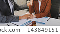 Businessmen or lawyers working together at a meeting, teamwork and partnership. Signing documents, contracts, checking details business agreement 143849151