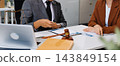Businessmen or lawyers working together at a meeting, teamwork and partnership. Signing documents, contracts, checking details business agreement 143849154