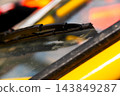 Close-up of windshield wiper on vehicle windshield 143849287