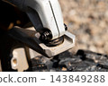 Close-up of ATV suspension knuckle and control arm component 143849288