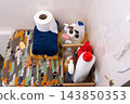 Bathroom Essentials Stacked With Cleaning Supplies at home 143850353