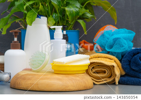 Soaps and Dispensers bottles. Natural eco set of shower gel and lotions and a washcloth Soaps and Dispensers bottles. Natural eco set of shower gel and lotions and a washcloth 143850354