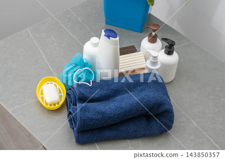 Towel washcloth, Bottles of shampoo, lotion liquid soap in the bathroom. Shower gel set for men Towel washcloth, Bottles of shampoo, lotion liquid soap in the bathroom. Shower gel set for men 143850357