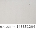 Recycled light craft paper texture background with natural fiber speckles. Clean flat lay macro texture of recycled paper, subtle natural specks, fiber details, natural background mockup, copy space 143851204