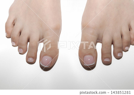 Well groomed female feet with french pedicure 143851281