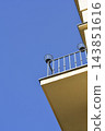 Minimalist balcony with metal railing against blue sky 143851616