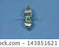 Mint green metallic origami paper crane on blue background 143851621