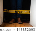 Halloween decorations with creepy person standing in doorway 143852093