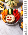 Halloween healthy snack Hummus in shape on pumpkin jack-o-lanter 143852255