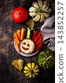 Halloween healthy snack Hummus in shape on pumpkin jack-o-lanter 143852257