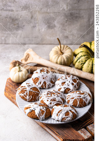 Spooky Halloween mummy cookies with eyes Spooky Halloween mummy cookies with eyes 143852268