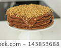 Homemade chocolate cake with nuts served on a plate close up 143853688