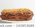Homemade chocolate cake with nuts served on a plate close up 143853689