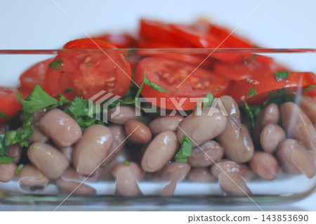 Close up of homemade bean and tomato salad Close up of homemade bean and tomato salad 143853690