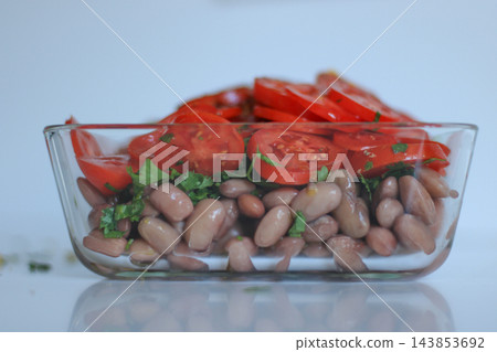 Close up of homemade bean and tomato salad Close up of homemade bean and tomato salad 143853692