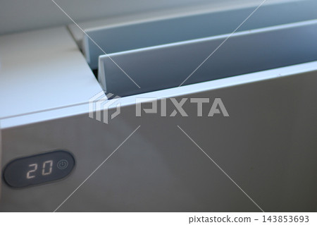 Air conditioner displaying twenty degrees on display Air conditioner displaying twenty degrees on display 143853693