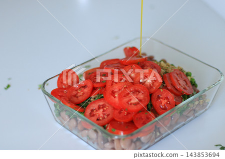 Close up of homemade bean and tomato salad Close up of homemade bean and tomato salad 143853694