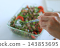 Fresh bean and tomato salad being prepared 143853695