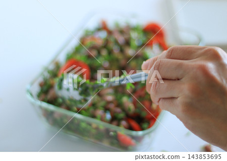 Fresh bean and tomato salad being prepared Fresh bean and tomato salad being prepared 143853695
