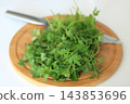 Fresh parsley and kitchen knife on wooden board 143853696