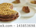 Homemade chocolate cake with nuts served on a plate close up 143853698