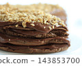 Homemade chocolate cake with nuts served on a plate close up 143853700