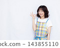 Housewife making an OK sign 143855110
