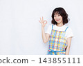 Housewife making an OK sign 143855111