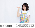 Housewife making an OK sign 143855112