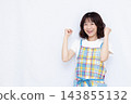 A housewife doing a fist pump 143855132