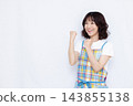 A housewife doing a fist pump 143855138