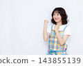 A housewife doing a fist pump 143855139