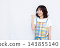 A housewife doing a fist pump 143855140