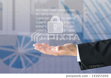 一位商人手持掛鎖和二進位代碼——這是加密和網路安全的象徵。 一位商人手持掛鎖和二進位代碼——這是加密和網路安全的象徵。 143855849