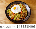 Fried noodles with fried egg 143856496