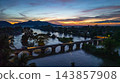 Aerial View of Mekong River Valley with Red Bridge at Sunset 143857908