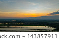 Scenic Sunset Sky Above Calm Wetland Landscape 143857911