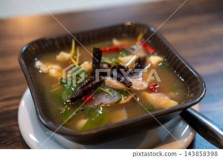 Tom yum, Thai Seafood spicy soup in a bowl. Tom yum, Thai Seafood spicy soup in a bowl. 143858398