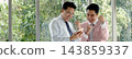 Banner Two businesspeople meeting work at office desk. Teamwork partners team with Business strategy chart graph, infographic financial report. Team partner planning excel stat report with copy space 143859337