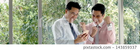 Banner Two businesspeople meeting work at office desk. Teamwork partners team with Business strategy chart graph, infographic financial report. Team partner planning excel stat report with copy space 143859337