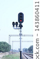 traffic light on railroad 143860411