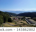 Terraced rice fields in Hirabayashi, Fujikawa Town, Yamanashi Prefecture, with a view of Mt. Fuji: Autumn rural landscape 143862802