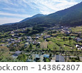 Terraced rice fields in Hirabayashi, Fujikawa Town, Yamanashi Prefecture, with a view of Mt. Fuji: Autumn rural landscape 143862807