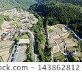 Terraced rice fields in Hirabayashi, Fujikawa Town, Yamanashi Prefecture, with a view of Mt. Fuji: Autumn rural landscape 143862812